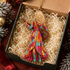 Customer in Austin, Texas wearing Dolly Parton Christmas Ornament Have A Holly Dolly Country Music Fan Gift