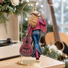 Customer in Austin, Texas wearing Dolly Parton Ornament Have a Holly Dolly Christmas Cowgirl Guitar Holiday Tree Decor Gift for Countr