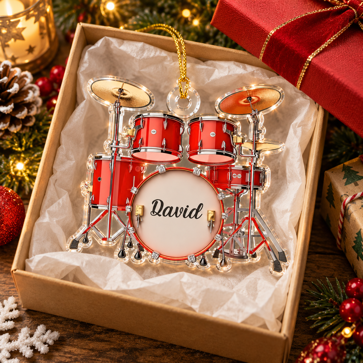 Gift for drummer: acrylic drum set Christmas ornament nestled inside an open gift box lined with tissue paper, featuring the