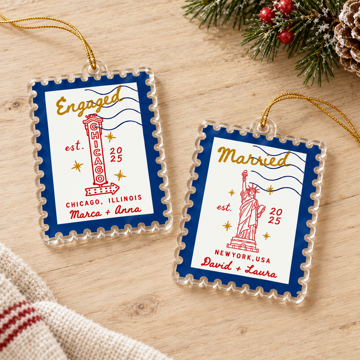 Two personalized acrylic Christmas ornaments resting on a wooden tabletop.