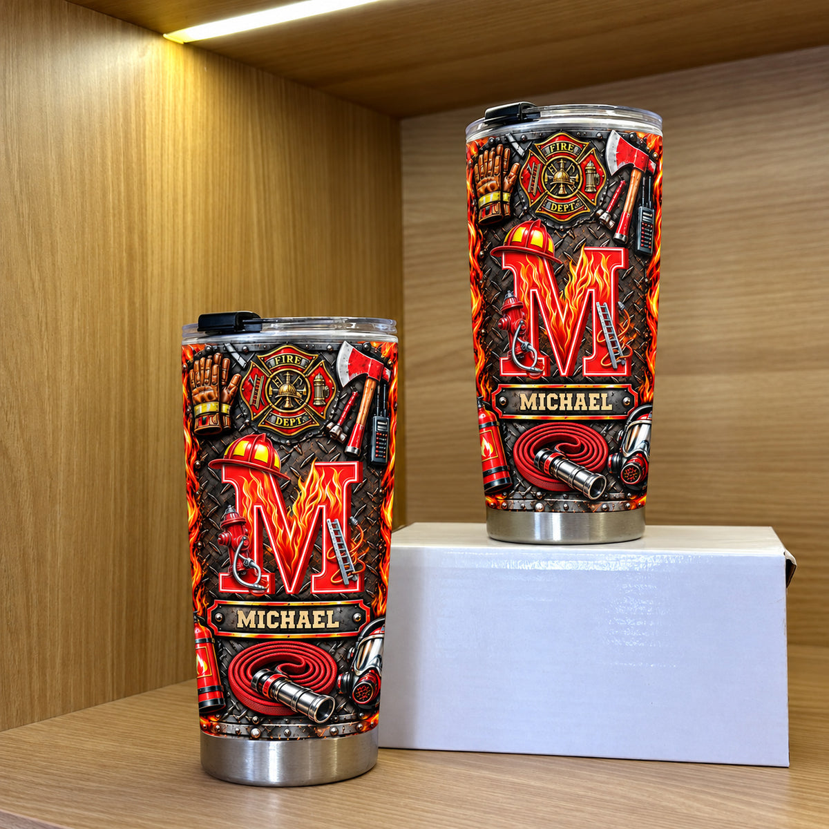 Two custom firefighter tumblers displayed on a wooden shelf with warm accent lighting.