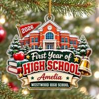 High school freshman gift ornament hanging on a snowy Christmas tree branch.