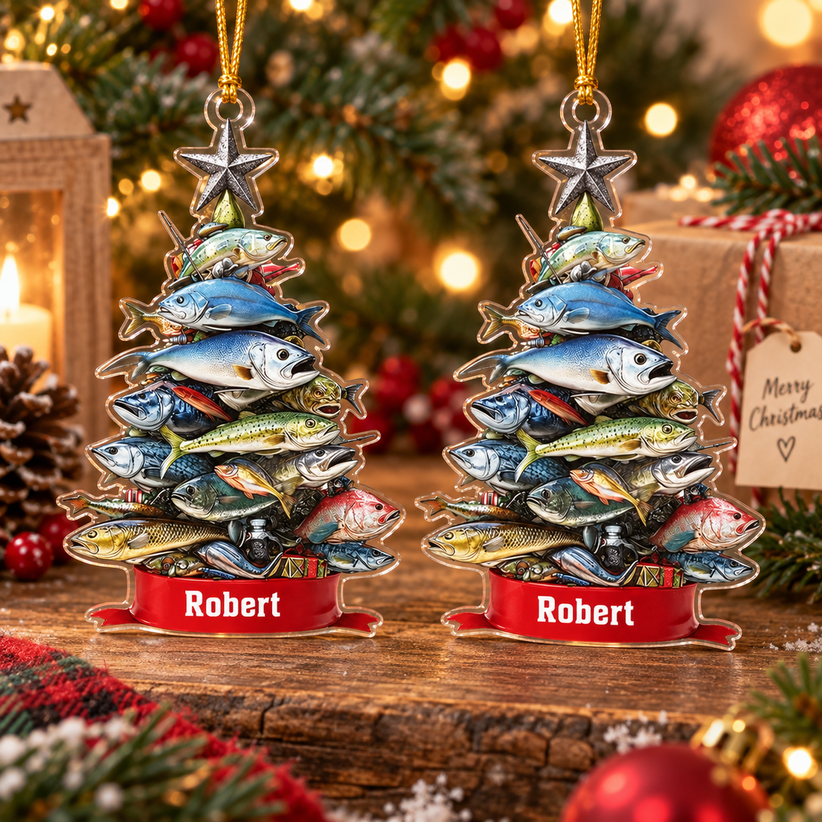 Two personalized acrylic fish stack christmas ornaments displayed together on a rustic wooden table with holiday decorations.