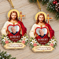 Two Christian memorial ornaments side by side on a wooden surface showing custom name and dates.
