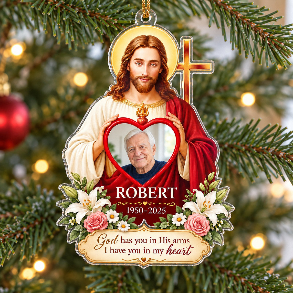 Close-up of the Christian memorial ornament hanging on a lit Christmas tree.