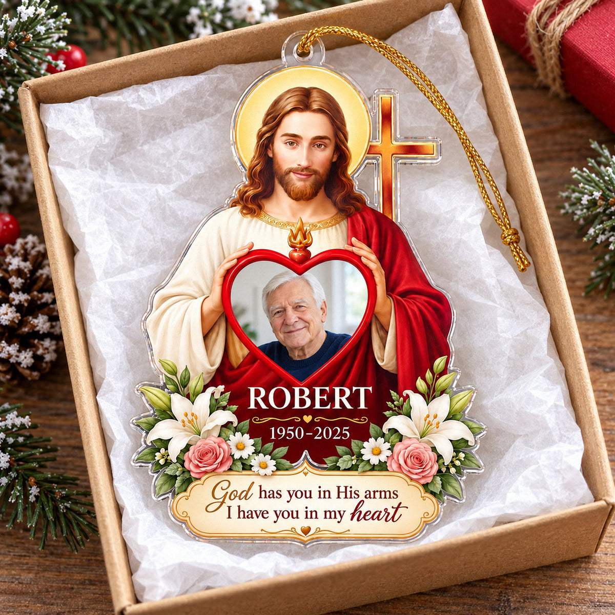 Christian memorial ornament resting inside an open gift box lined with white tissue paper.