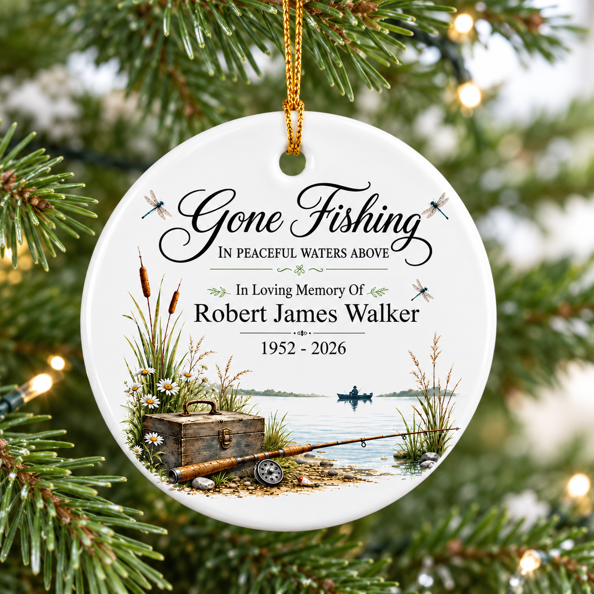 Personalized memorial ornament hanging on Christmas tree with fishing scene and custom name