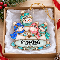Personalized family keepsake ornament in a gift box lined with white tissue paper, tied with a gold string against a wooden