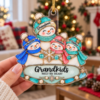 Person holding the custom name snowman ornament indoors with a softly blurred Christmas tree and holiday decorations in the