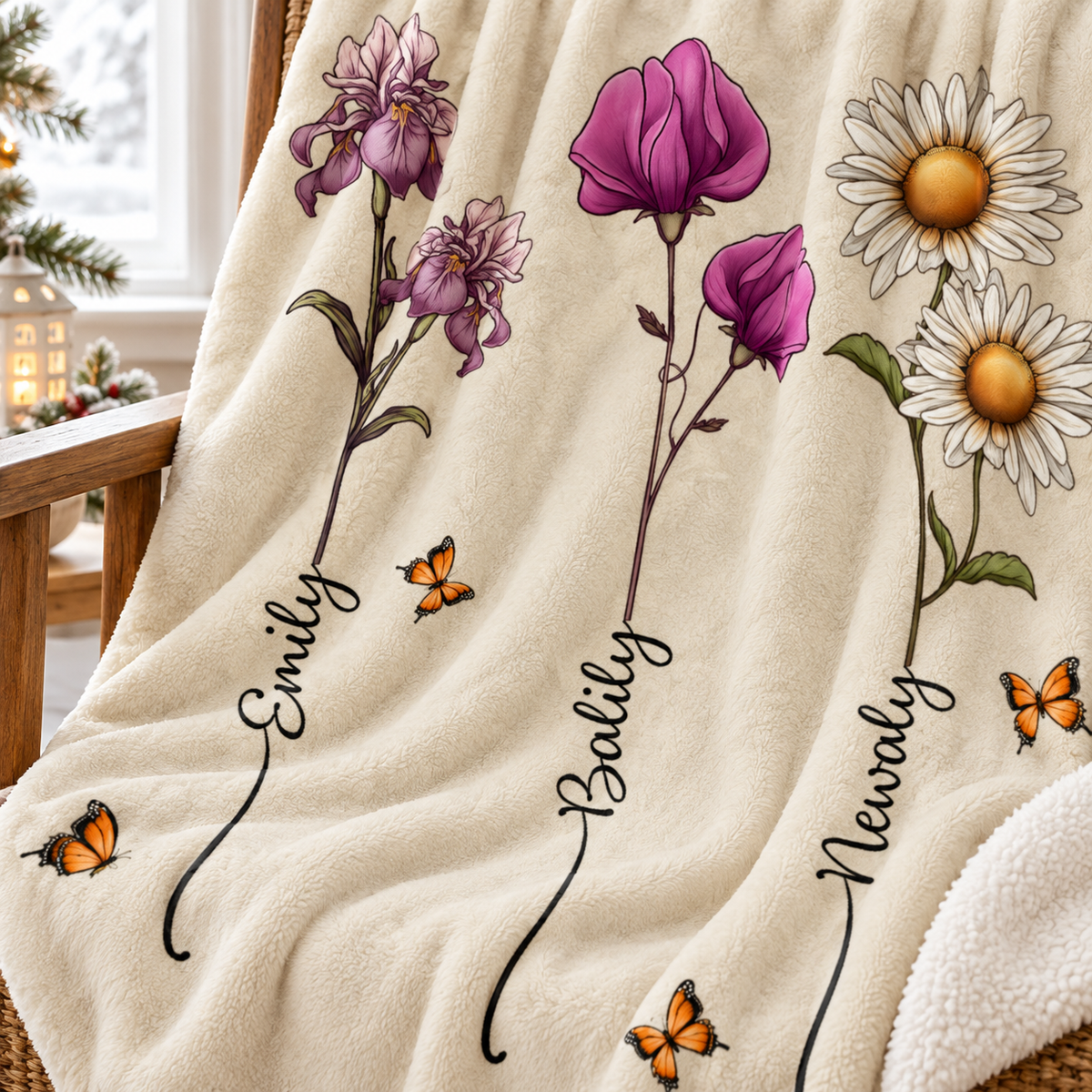 Close-up of the watercolor floral blanket showing stems printed with grandchildren names and butterflies.
