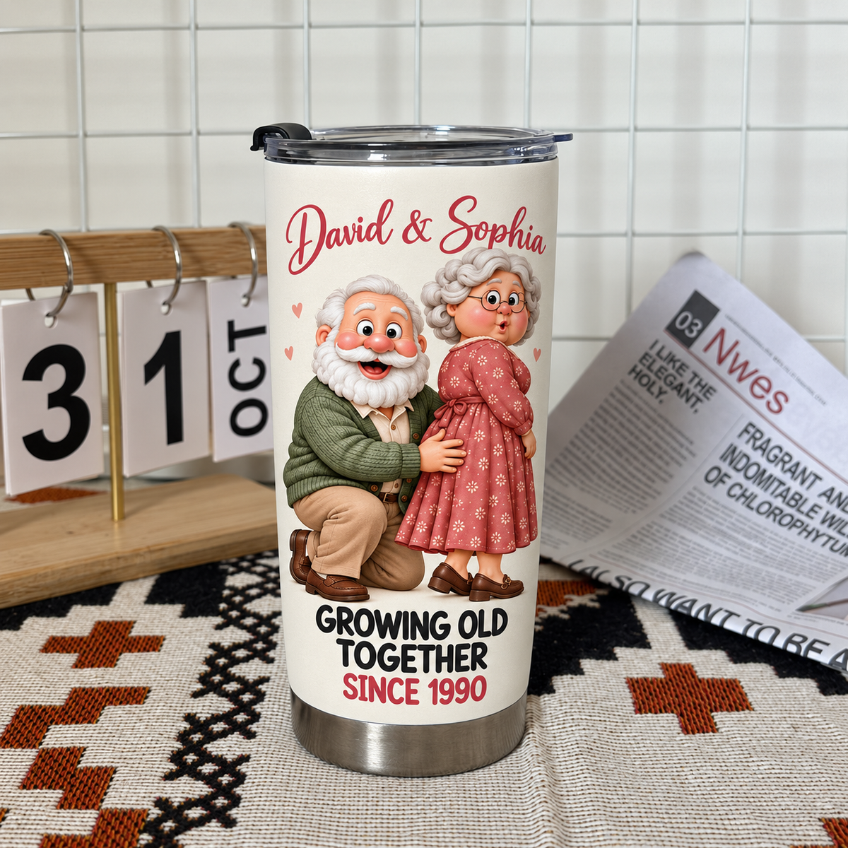 White stainless steel travel tumbler with a cartoon elderly couple and David & Sophia text standing on a patterned mat next