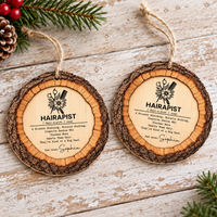 Two flat wooden definition ornaments for hairdressers displayed side by side on wood.