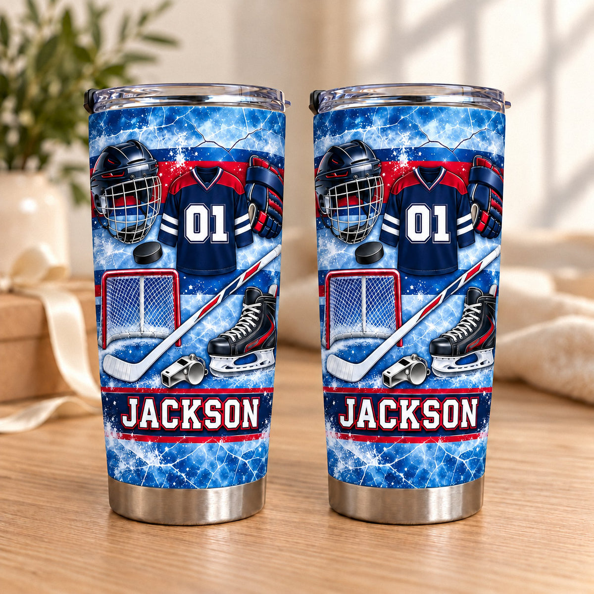 Two personalized ice hockey equipment collage tumblers with blue and red designs, helmet, jersey, stick, and the name JACKSON