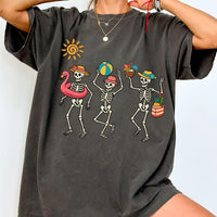 Charcoal gray t-shirt with a cute spooky summer skeleton graphic, worn by a model.