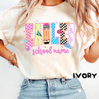 Close-up of an ivory t-shirt featuring a colorful retro school mascot graphic design.