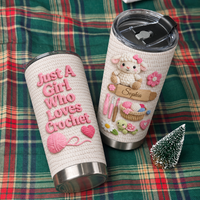 Personalized insulated stainless steel cup on green plaid fabric next to miniature Christmas tree, showing crochet graphics.