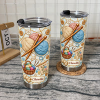 Two stainless steel tumblers with a knitting yarn graphic, black lids, and the custom name Charoltte printed on a label