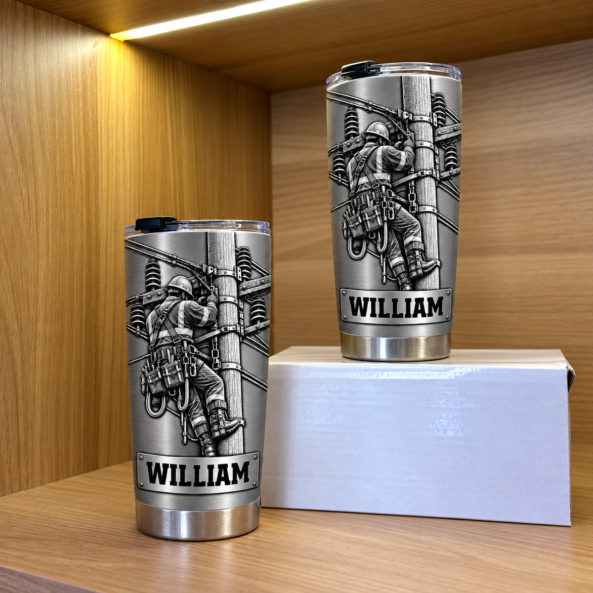 Two personalized tumbler utility worker options displayed on a wooden shelf in front of a white box.