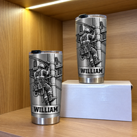 Two personalized tumbler utility worker options displayed on a wooden shelf in front of a white box.