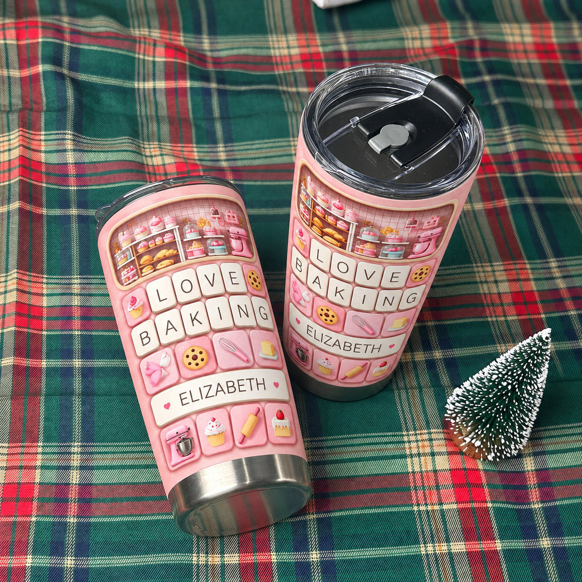 Two pink stainless steel tumblers featuring a keyboard design with baking icons and the custom name ELIZABETH on a plaid