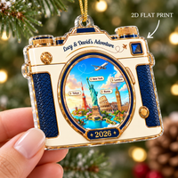 Hand holding a single-sided flat acrylic travel ornament featuring global landmarks in the lens.