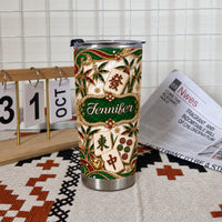 Personalized mahjong tumbler on patterned mat next to small calendar block and newspaper in bright room.