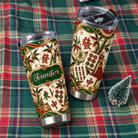 Two stainless steel mahjong tumblers with cream, green, red and gold tile print, custom name Jennifer, on plaid cloth.