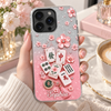 Customer in Austin, Texas wearing Mahjong Cherry Blossom Phone Case Personalized Clear Cover with Pink Glitter Tiles and Sakura Design