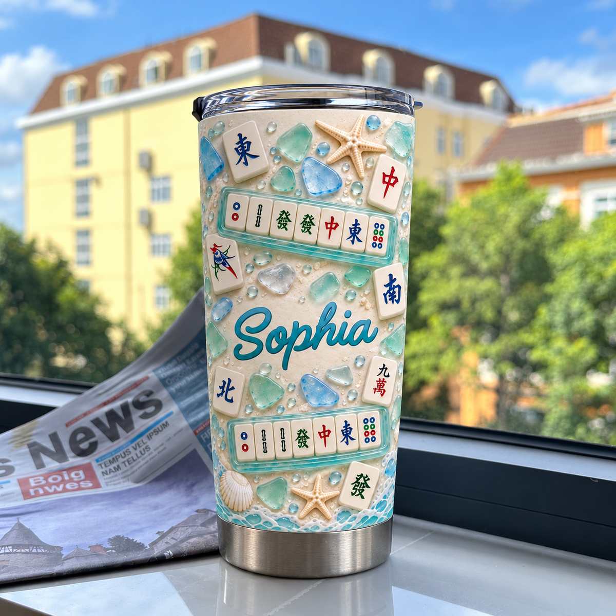 A Mahjong lover gift tumbler stands on a sunny windowsill with trees and buildings outside.