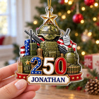 Hand holding the America 250th anniversary ornament with a custom name printed on the bottom ribbon.