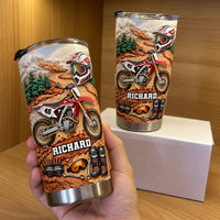 Hand holding personalized motocross dirt bike gear tumbler with custom name Richard and red racing theme.