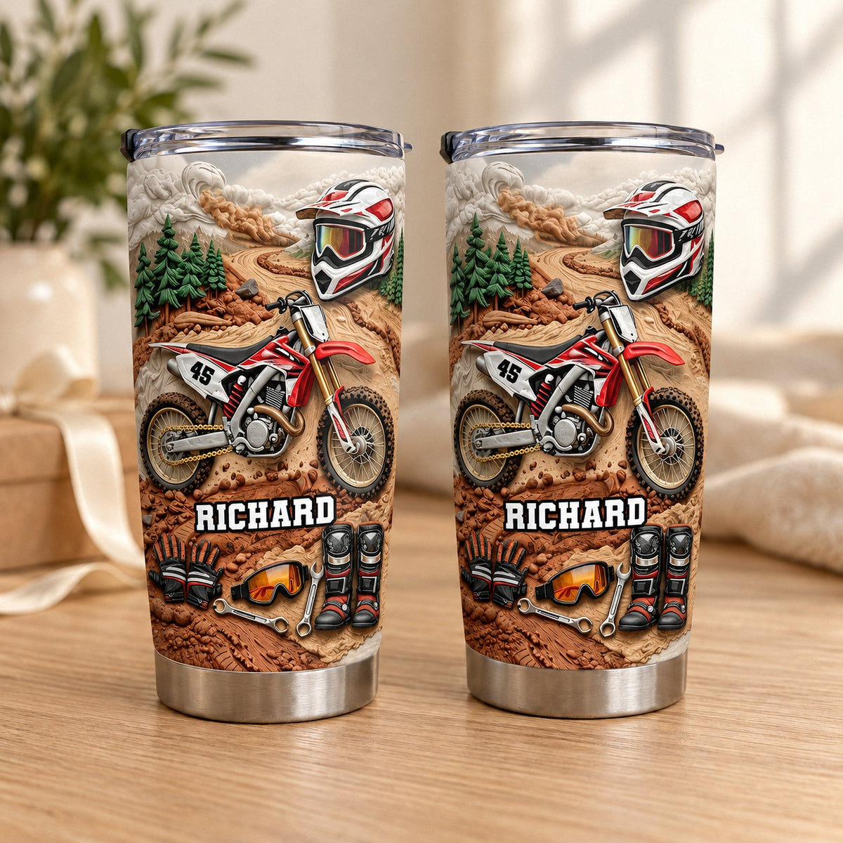 Two personalized stainless steel tumblers with a red motocross dirt bike design featuring the name Richard on a wooden