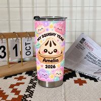 Single My Squishy Year Tumbler with custom dumpling design next to a calendar block and newspaper.