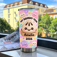 Stainless steel travel mug featuring kawaii bao bun art placed on a windowsill with a newspaper and buildings outside.