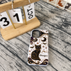Close-up of Mystical Black Cat Phone Case Celestial Gothic Witchy Design with Gold Stars Moons Bats for Cat Love for streetwear fans in Austin, Texas