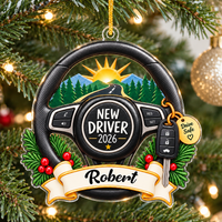 New Driver Drive Safe Christmas ornament hanging on a pine tree, featuring a steering wheel design with a highway sunrise and