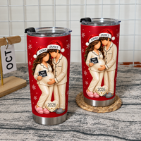 Two red ultrasound tumblers with matching cream pajamas on a rustic wooden table with a calendar.