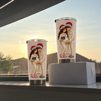 Two cream custom name pregnancy tumblers in different sizes displayed against a sunset window backdrop.