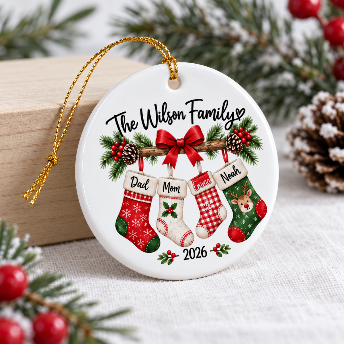 Holiday gift for parents ceramic ornament displayed on a wooden surface next to pinecones.