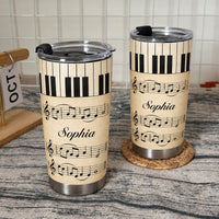 Two stainless steel tumblers with vintage piano keys and sheet music design, personalized with the name Sophia in the center.