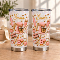 Two custom name tumblers with pink baking graphics on pearlescent white stainless steel