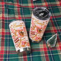Two personalized baker gift tumblers resting on a green and red plaid cloth