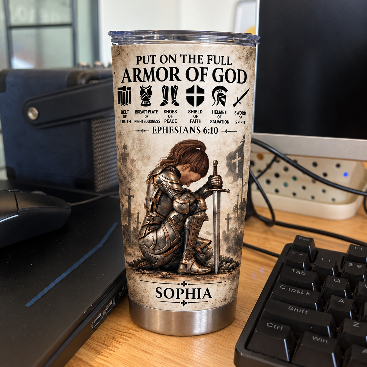 A custom name tumbler reading Sophia next to a computer keyboard, featuring a female knight graphic.