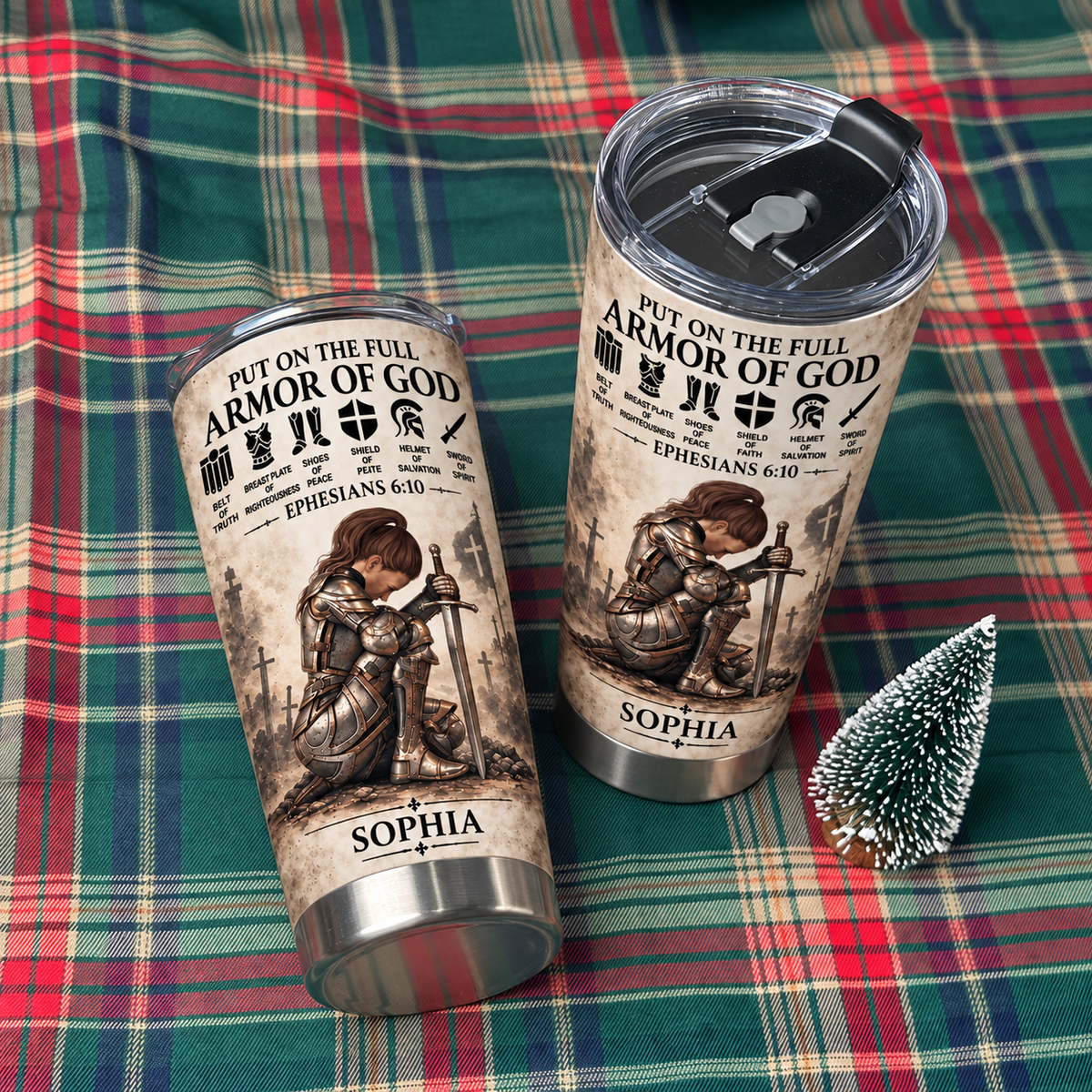 Two custom name tumblers featuring a female knight and Sophia personalization set on a colorful plaid blanket.
