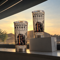 Two Full Armor Of God travel tumblers with male knight graphic and Matthew name placed near a sunlit window.
