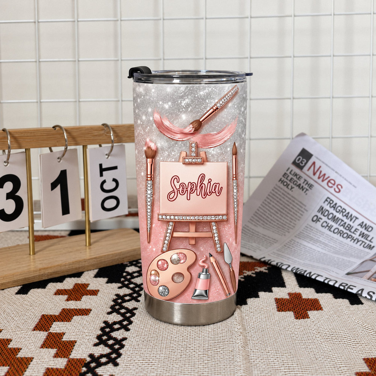 Custom name cup on a textured rug near a calendar showing October 31.
