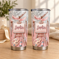 Two stainless steel tumblers with a rose gold glitter design showing artist tools, easel canvas, and the custom name Sophia.