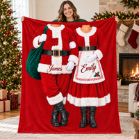 Santa and Mrs Claus Costume Couple Blanket held up by a woman in front of a decorated Christmas tree