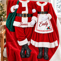 Holiday Sherpa throw draped over a wooden chair showing custom Santa and Mrs Claus couple outfit design