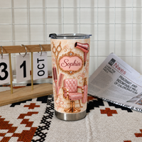 Personalized hair stylist tumbler with rose gold salon design displayed on patterned mat next to calendar block and